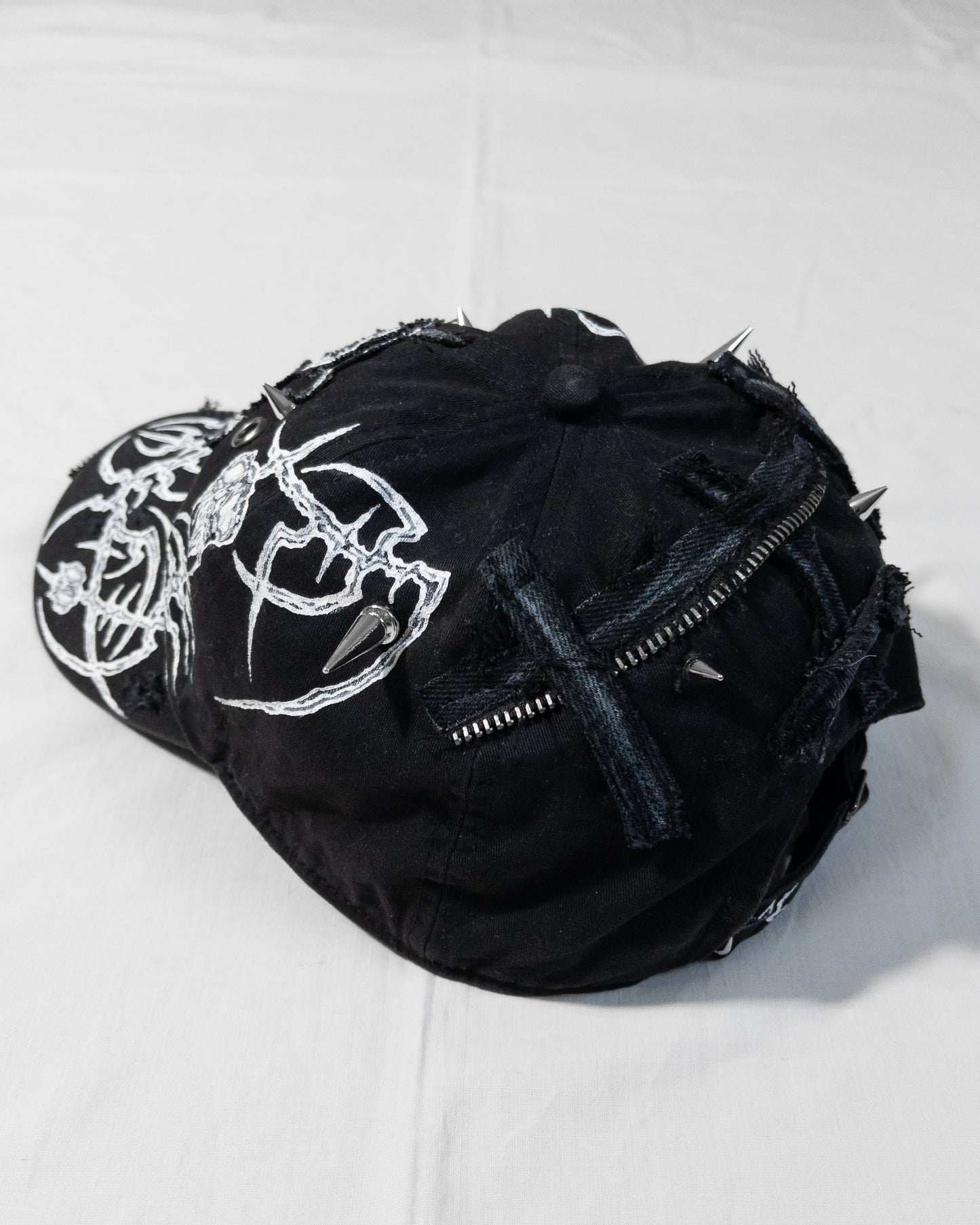 "crucified" cap